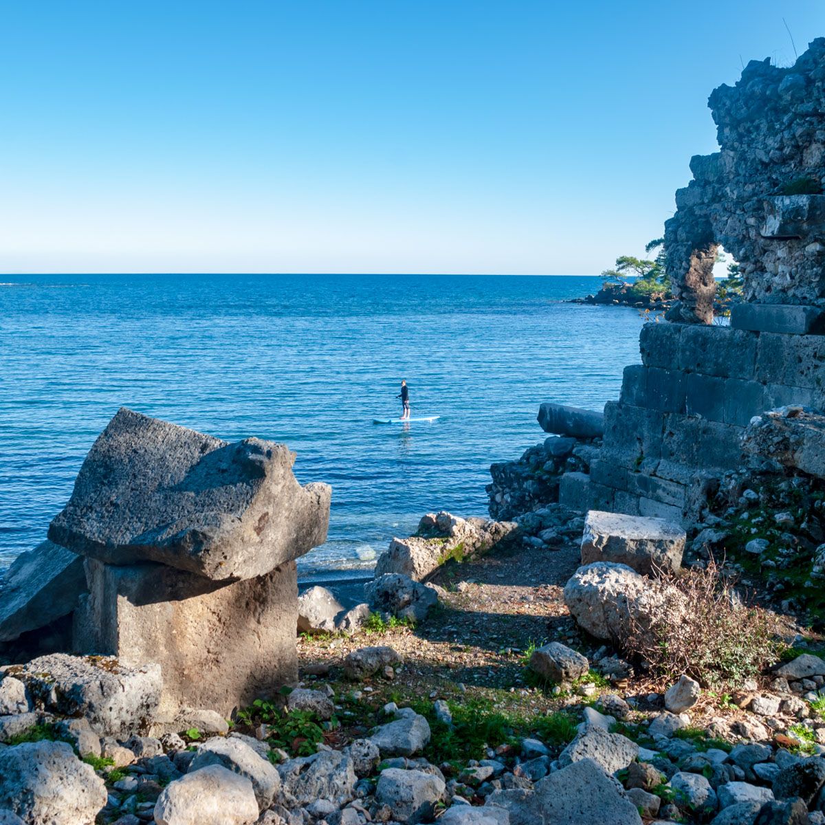 Paddleboarder through the ruins of Phaselis