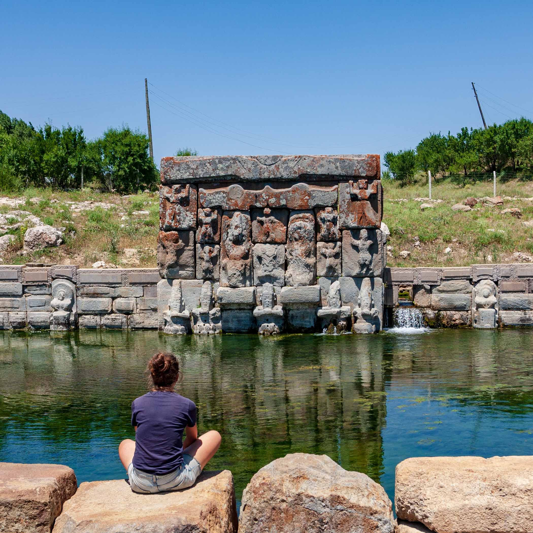 Sitting by the pool of a Hittite fountain, Eflatunpınarı